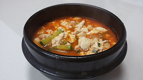 Soft tofu stew in a stone pot