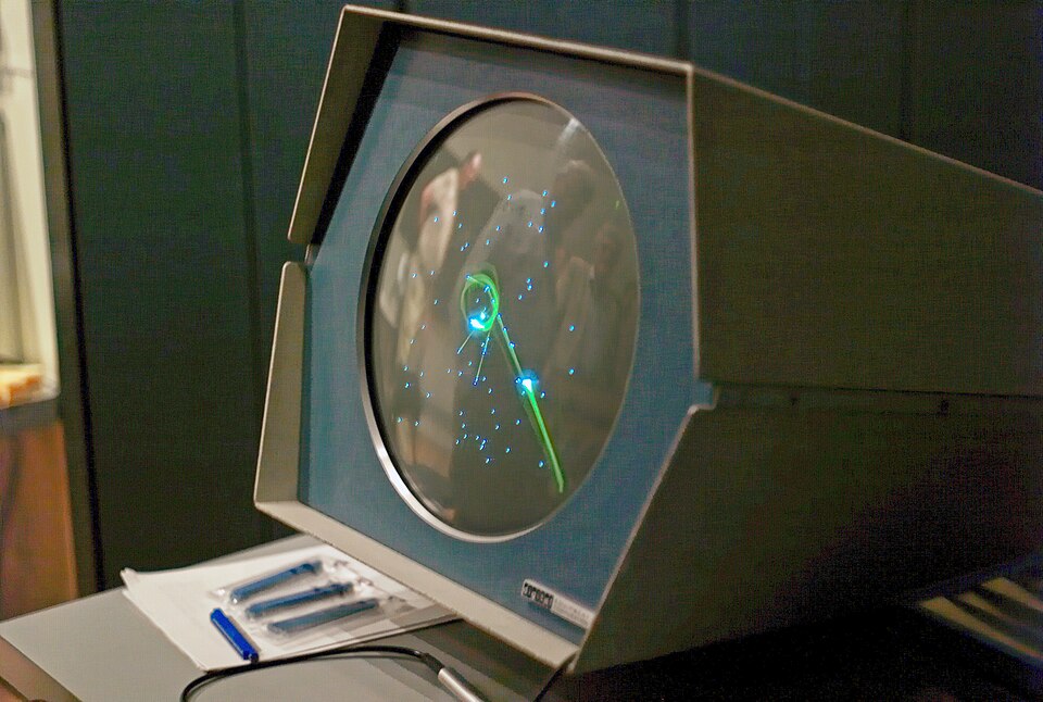 Spacewar! running on a PDP-1 computer's circular display.
