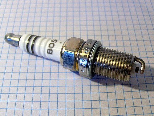 Spark plug insulator